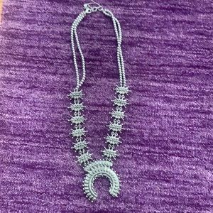 Squash blossom styled necklace